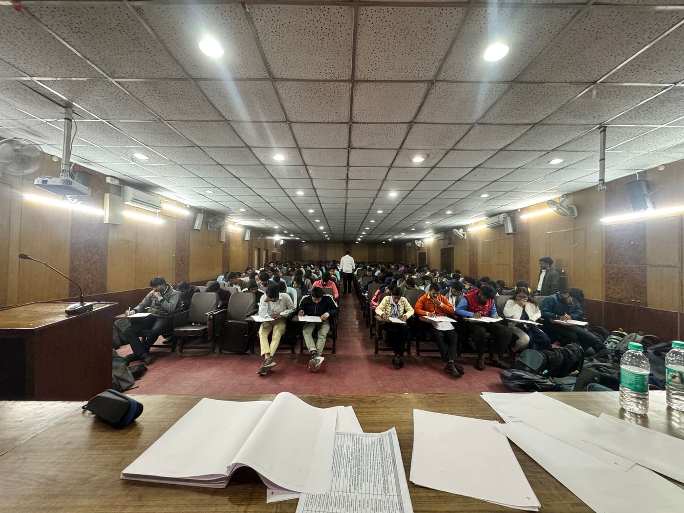 A packed auditorium of students writing the aptitude round at the Kolaghat campus drive