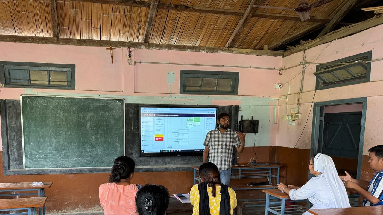 Academica ERP demonstrated on a smart board during a teacher training session at a school in Tripura
